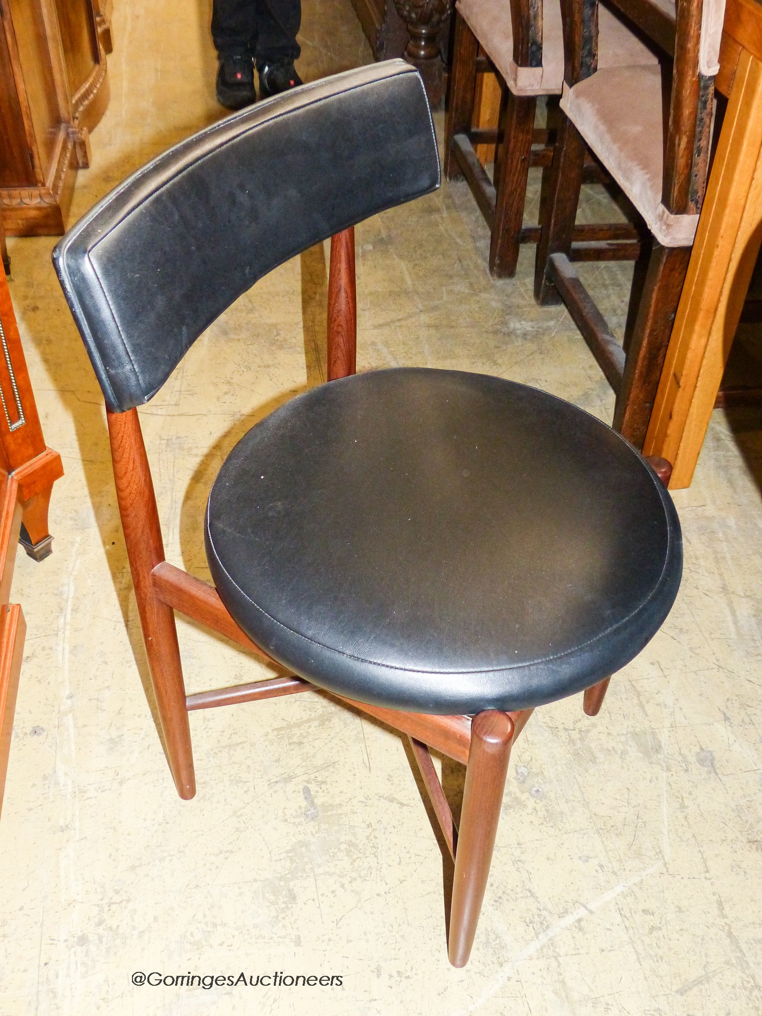 A teak and leatherette Fresco dining suite by Wilkins for G Plan, comprising circular extending dining table, 120cm diameter (166cm extended), height 73cm and four chairs